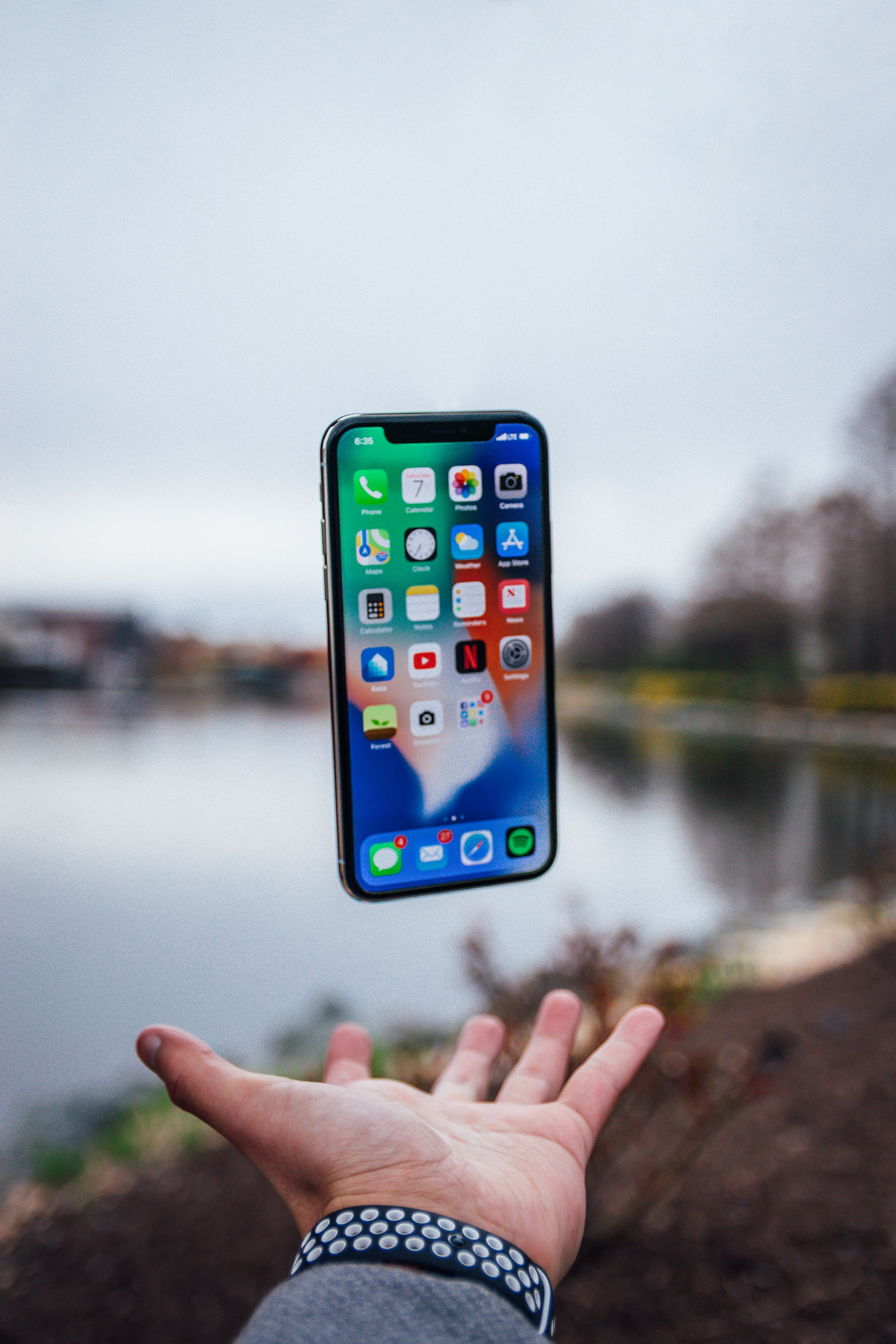 POV of iPhone floating above a person's hand
